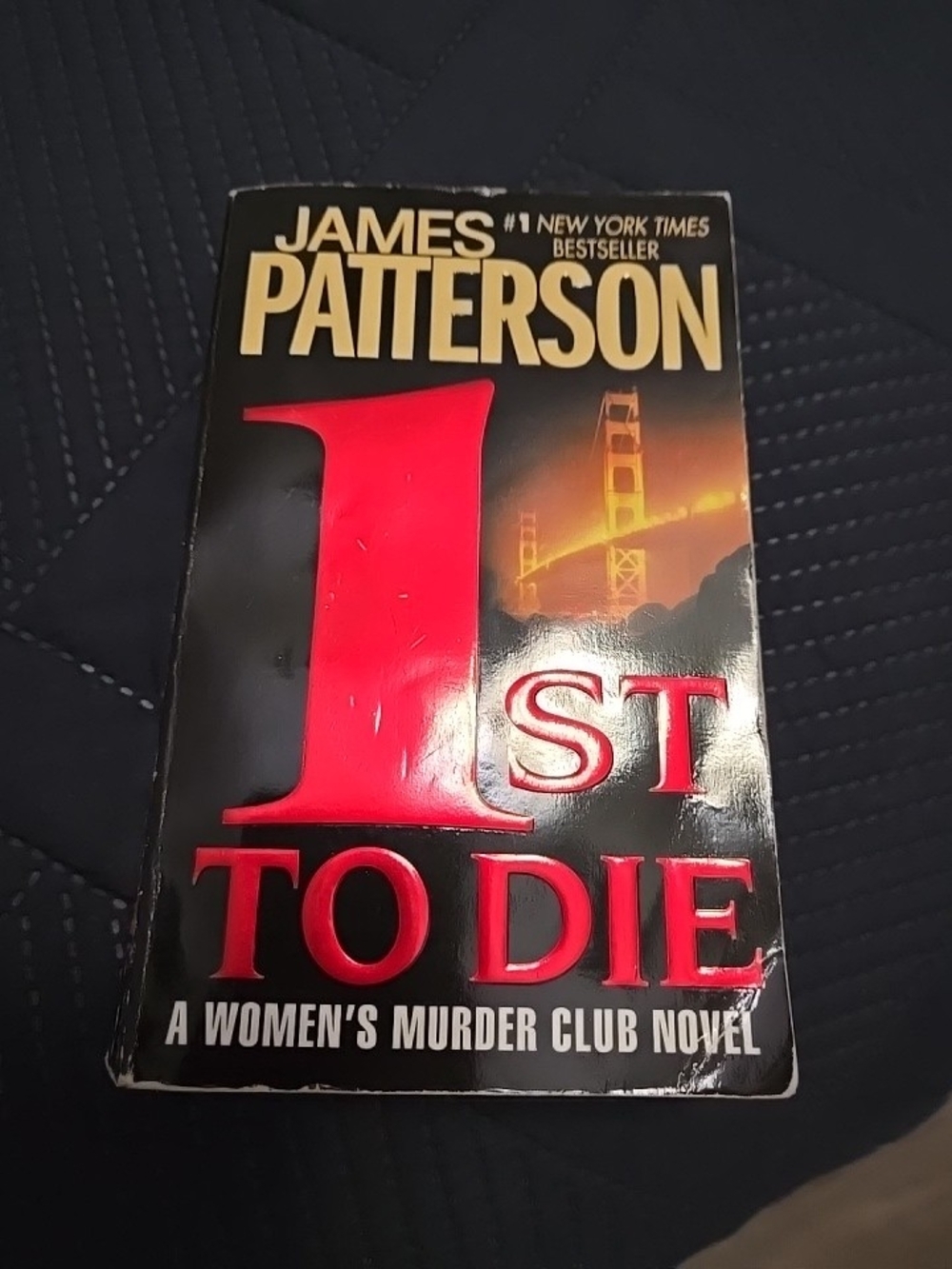 Paperbacks Black Cover with Red and Gold Accents - '1st to Die' Paperback